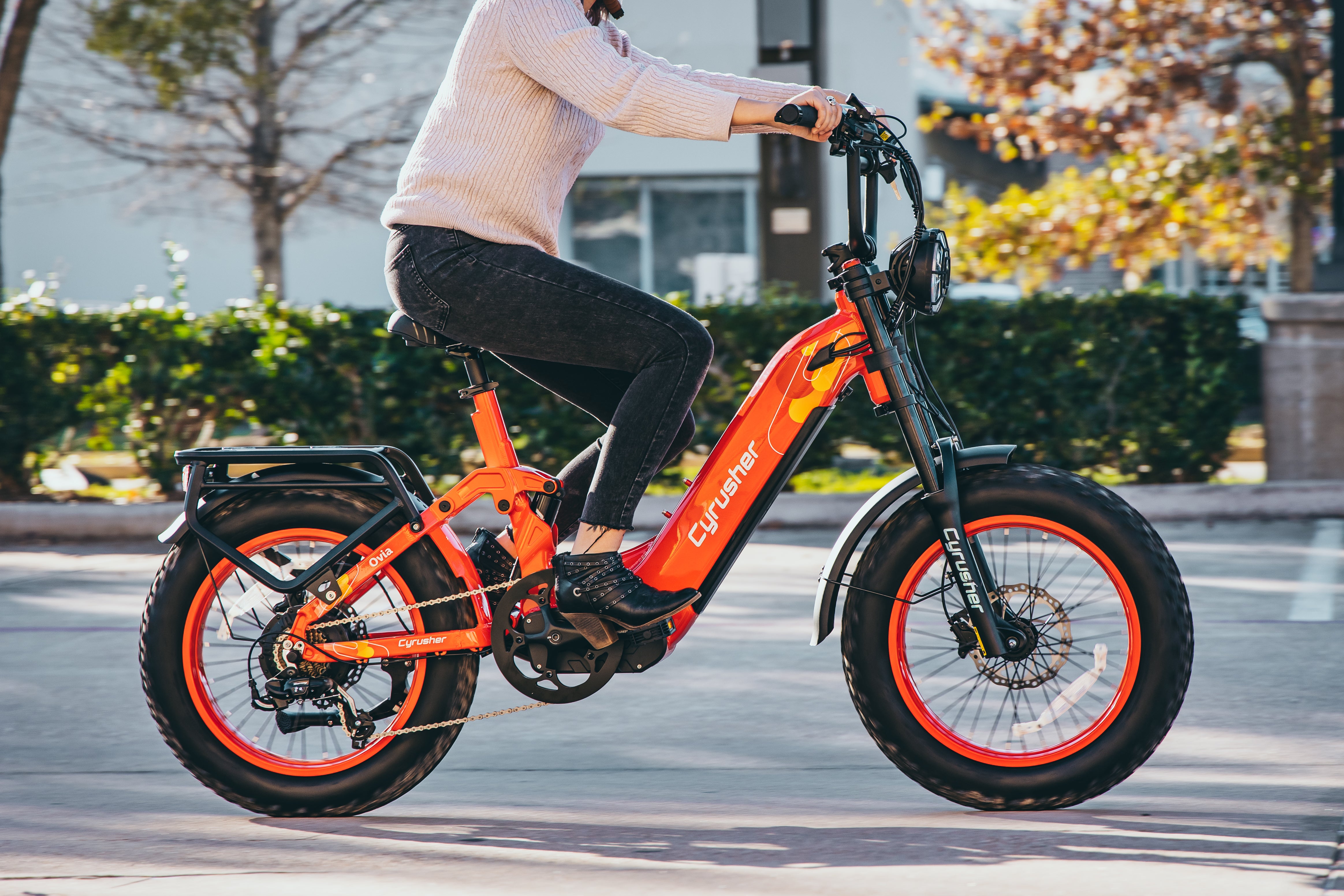 A woman rides an electric bike.-0103