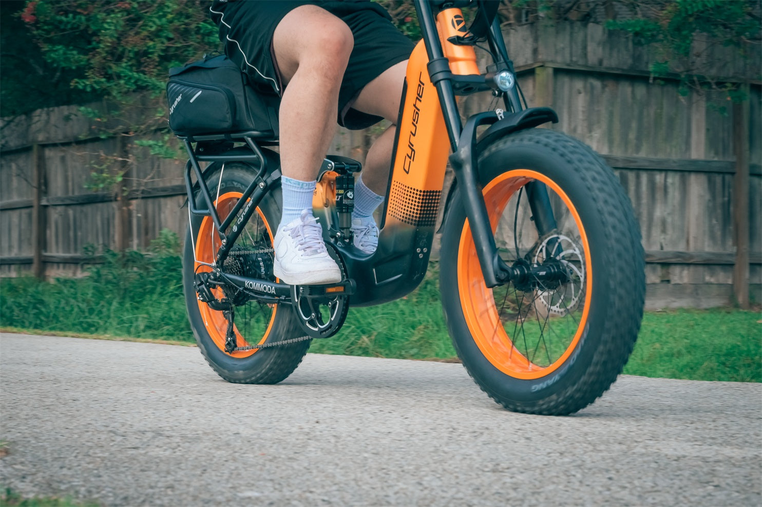 A man rides an electric bike on the road.-1027