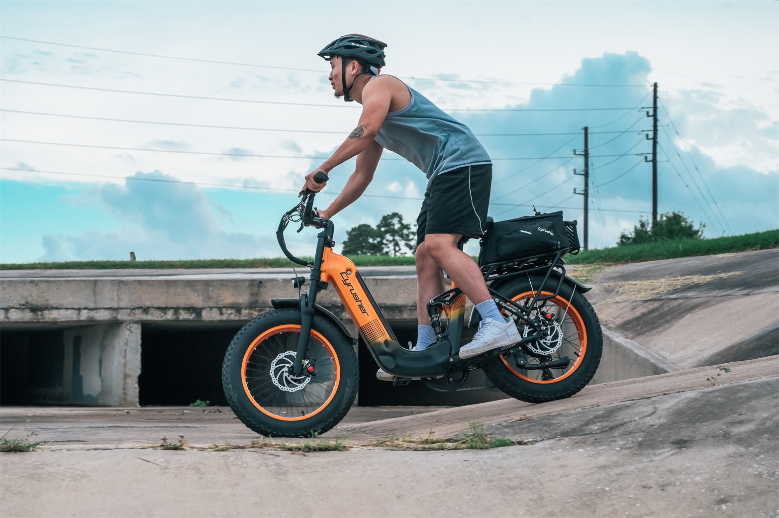 A man rides an electric bike on the road.-0928