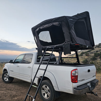 Roof top tent for outdoor camping, mounted on a pickup truck